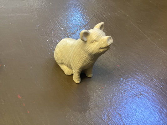 Resin pig sitting